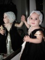 Cupcake Master, approximately age 1, wearing a princess dress.